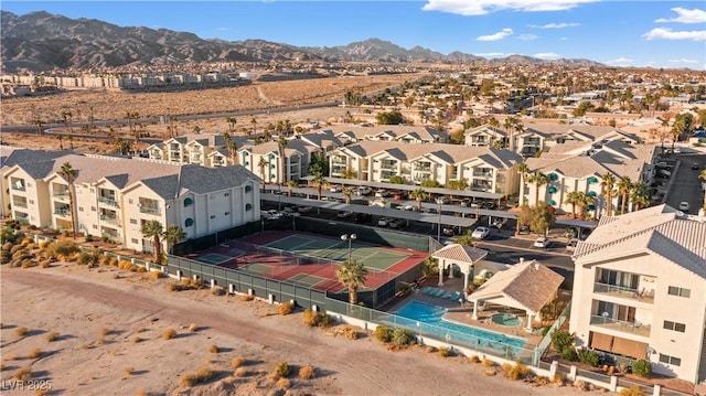 drone / aerial view with a residential view and a mountain view