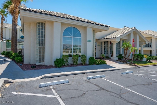 view of property with uncovered parking