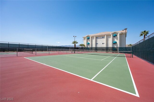 view of sport court with community basketball court and fence