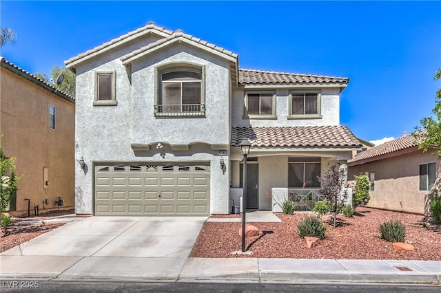 view of front of property with an attached garage, stucco siding, a tiled roof, a porch, and driveway