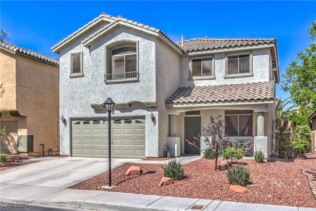 11143 Castellane Dr, Las Vegas, NV 89141 - view of front of house with a porch, a garage, a tile roof, and stucco siding
