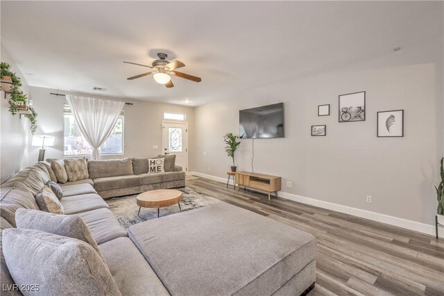 11143 Castellane Dr, Las Vegas, NV 89141 - living room featuring wood finished floors, ceiling fan, and baseboards