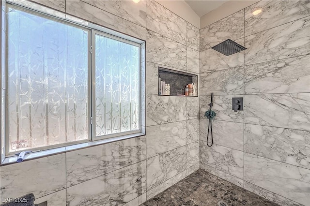 bathroom featuring tiled shower