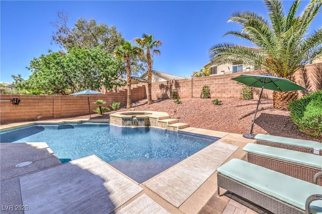 view of swimming pool with a fenced backyard and a pool with connected hot tub