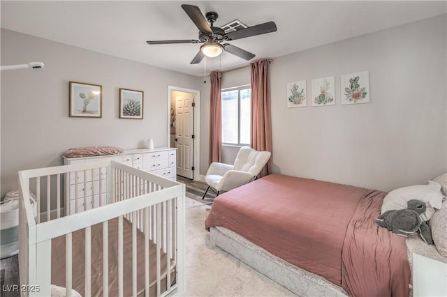 bedroom featuring a ceiling fan and visible vents