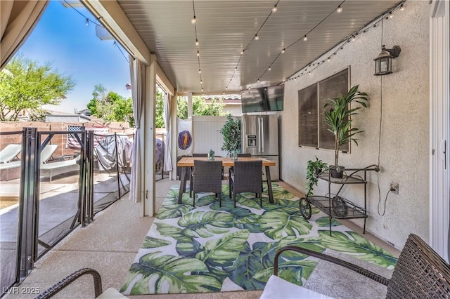 view of patio / terrace featuring fence and outdoor dining space