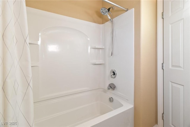 bathroom featuring shower / bath combo with shower curtain