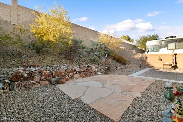 view of yard with a fenced backyard and a patio area
