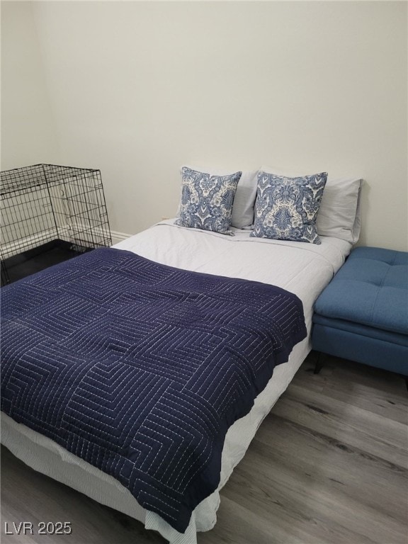 bedroom featuring wood finished floors