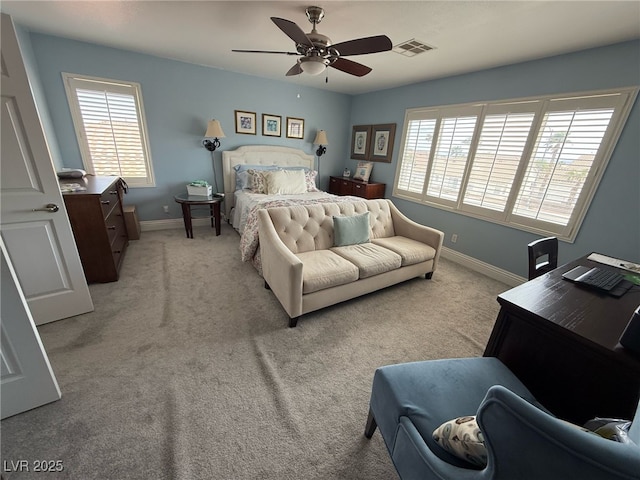 bedroom with visible vents, baseboards, ceiling fan, and light carpet