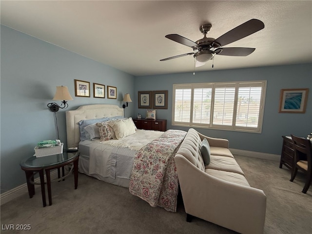 bedroom featuring baseboards, a ceiling fan, and carpet flooring