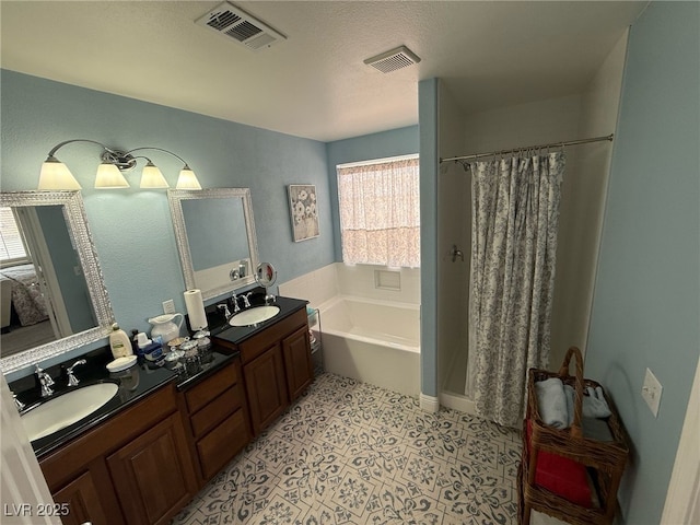full bath with visible vents, a sink, and a bath