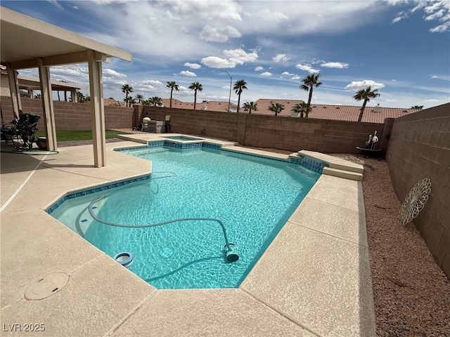 view of swimming pool with a patio, an in ground hot tub, a fenced in pool, and a fenced backyard