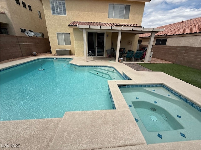 view of pool with a fenced in pool, an in ground hot tub, a patio area, and a fenced backyard