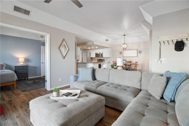 3550 Bay Sands Dr Unit 2101, Laughlin, NV 89029 - living area featuring visible vents, baseboards, ceiling fan, and dark wood-style floors