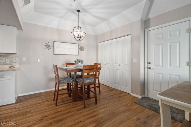 3550 Bay Sands Dr Unit 2101, Laughlin, NV 89029 - dining room featuring an inviting chandelier, baseboards, wood finished floors, and visible vents