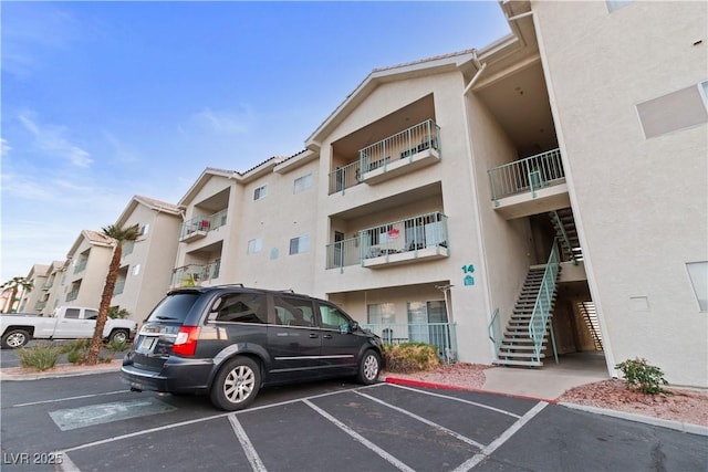 3550 Bay Sands Dr Unit 2101, Laughlin, NV 89029 - view of building exterior featuring stairs and uncovered parking