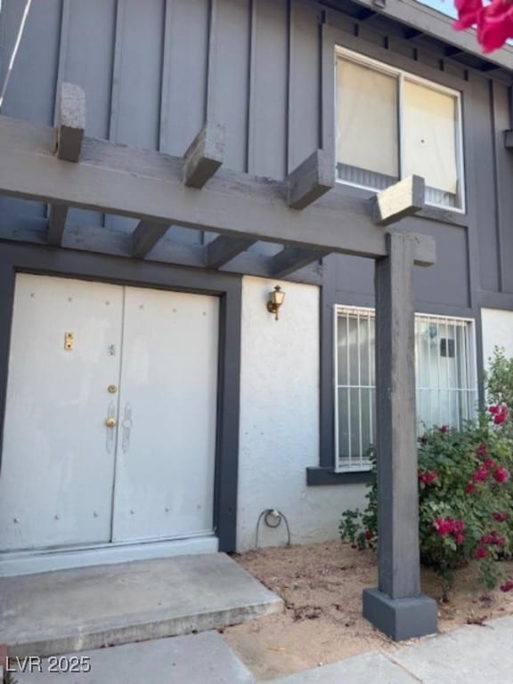 property entrance with board and batten siding