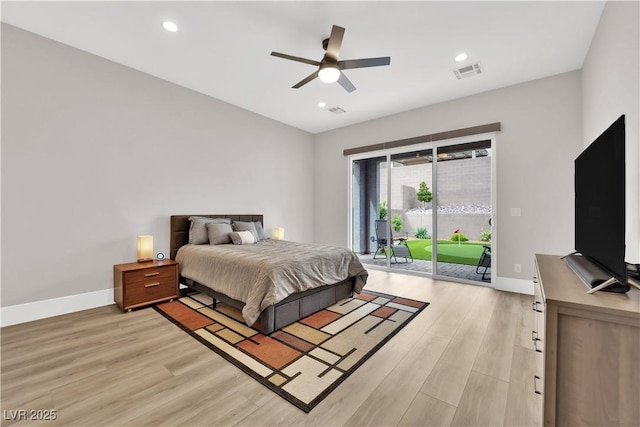 bedroom featuring visible vents, light wood-type flooring, baseboards, and access to exterior