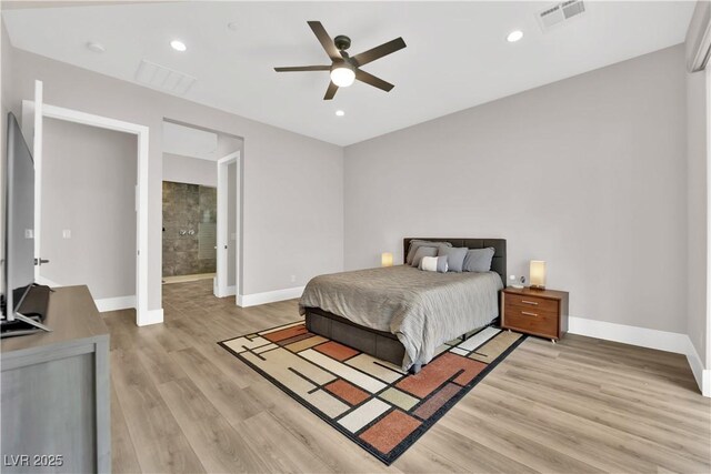 bedroom with baseboards, visible vents, and light wood-style floors