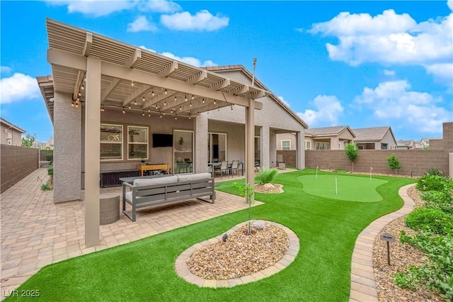 rear view of house with a pergola, stucco siding, outdoor lounge area, a fenced backyard, and a patio area