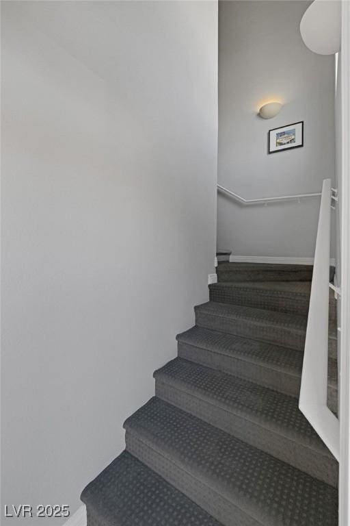 stairs featuring baseboards