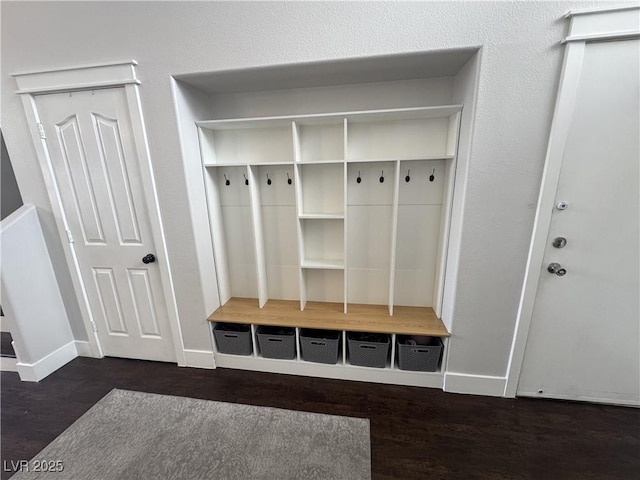 mudroom with baseboards and wood finished floors