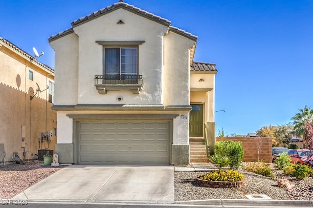 3592 Gloucester Gate St, Las Vegas, NV 89122 - mediterranean / spanish home featuring a garage, fence, stucco siding, concrete driveway, and a tile roof