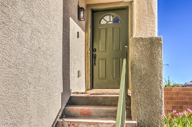 3592 Gloucester Gate St, Las Vegas, NV 89122 - doorway to property with fence and stucco siding