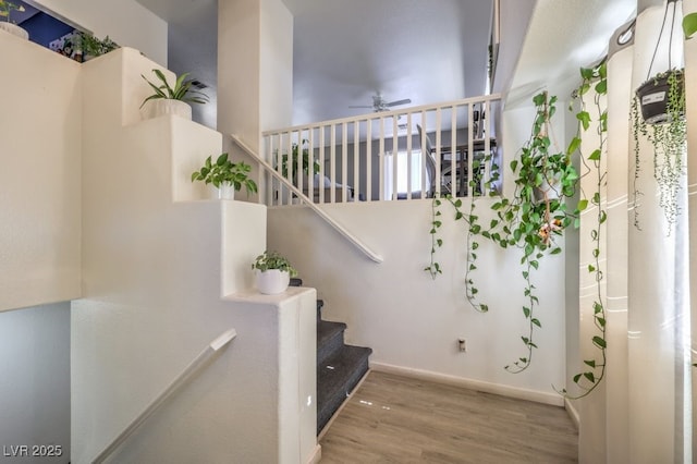 3592 Gloucester Gate St, Las Vegas, NV 89122 - stairway featuring baseboards, ceiling fan, and wood finished floors
