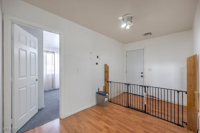 3592 Gloucester Gate St, Las Vegas, NV 89122 - spare room with baseboards, wood finished floors, and visible vents