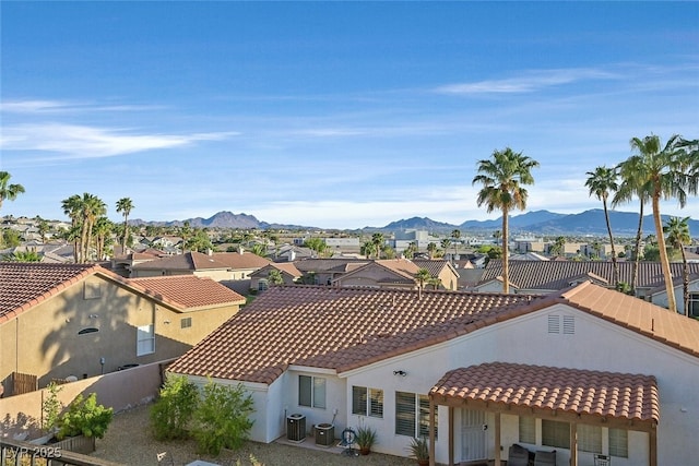 exterior space with a residential view and a mountain view