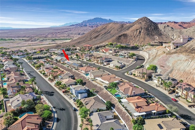 birds eye view of property featuring a mountain view and a residential view