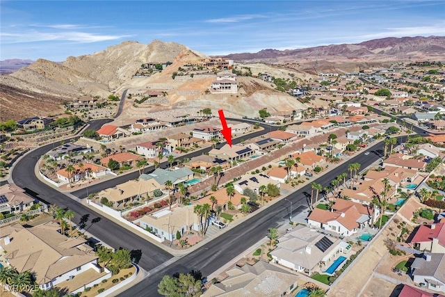 birds eye view of property with a mountain view and a residential view