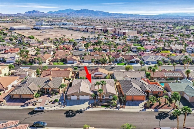 drone / aerial view with a mountain view and a residential view