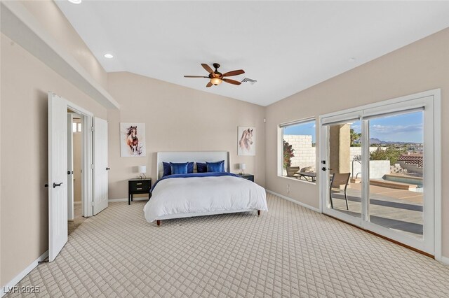 bedroom featuring baseboards, access to exterior, and light carpet