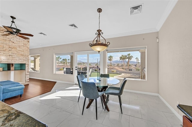 dining space with visible vents, marble finish floor, and crown molding