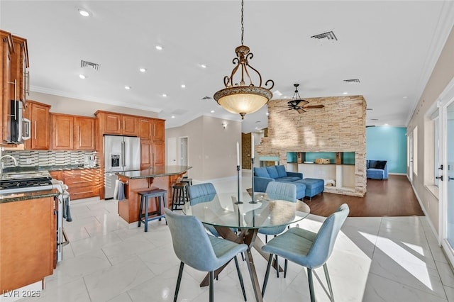dining area featuring ornamental molding, a ceiling fan, recessed lighting, and visible vents