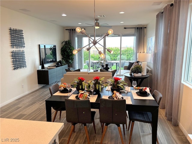 929 Hunter Shores Ave, North Las Vegas, NV 89084 - dining space featuring wood finished floors, baseboards, recessed lighting, a chandelier, and a ceiling fan