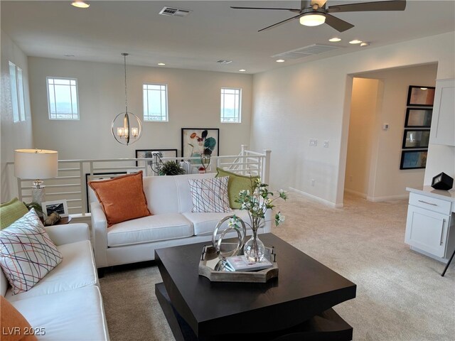 929 Hunter Shores Ave, North Las Vegas, NV 89084 - living area featuring ceiling fan, a chandelier, plenty of natural light, recessed lighting, and light carpet