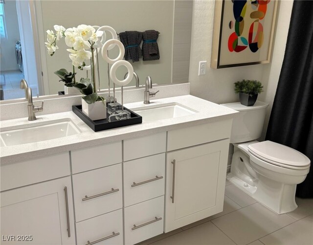 929 Hunter Shores Ave, North Las Vegas, NV 89084 - full bathroom featuring double vanity, toilet, and tile patterned flooring
