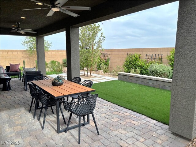 929 Hunter Shores Ave, North Las Vegas, NV 89084 - fenced backyard featuring a ceiling fan, a patio area, and outdoor dining area