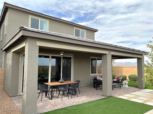 929 Hunter Shores Ave, North Las Vegas, NV 89084 - back of property with stucco siding and a patio area