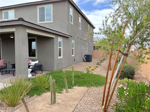 929 Hunter Shores Ave, North Las Vegas, NV 89084 - view of home's exterior featuring cooling unit, stucco siding, and a patio