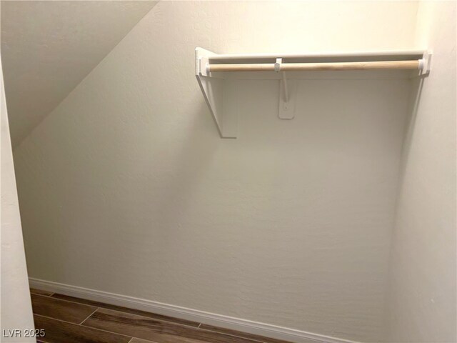 929 Hunter Shores Ave, North Las Vegas, NV 89084 - spacious closet featuring dark wood-style floors and lofted ceiling