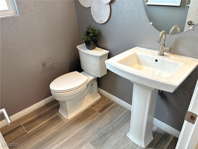 929 Hunter Shores Ave, North Las Vegas, NV 89084 - half bathroom featuring toilet, wood finished floors, and baseboards