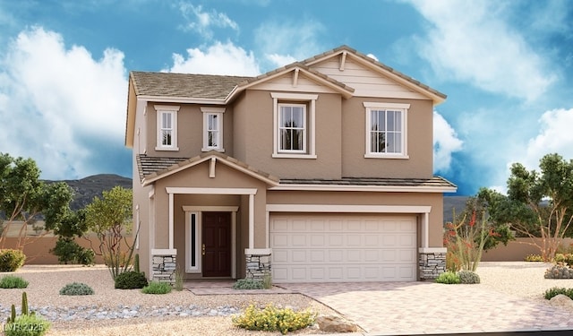 craftsman-style house featuring stucco siding, decorative driveway, a tile roof, and a garage