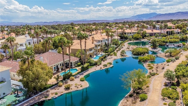 birds eye view of property with a residential view and a water and mountain view