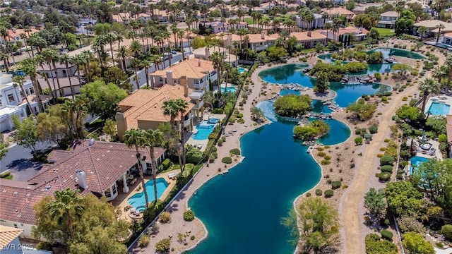birds eye view of property featuring a water view and a residential view