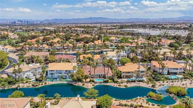 aerial view with a water and mountain view and a residential view